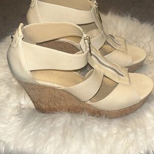 Michael Kors wedges sandals in a size 9 women’s.